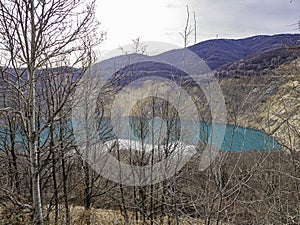 Bright blue artificial cooper mine lake.