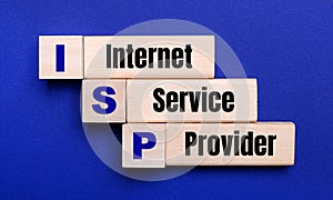 On a bright blue background, light wooden blocks and cubes with the text ISP Internet Service Provider photo