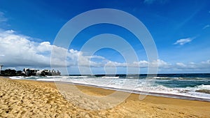 bright blue beach sky and sand with nice clouds