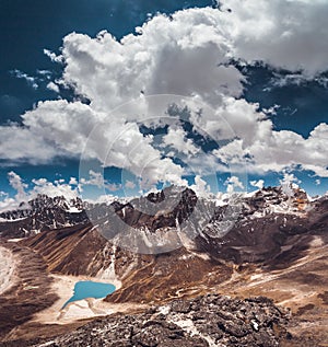 The bright blue cloudy sky above the Himalayas.