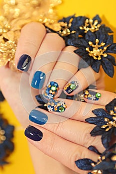 Bright blue manicure with the design of rhinestones photo