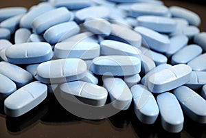 Bright blue oval tablets