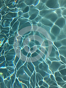 Bright blue pool water closeup