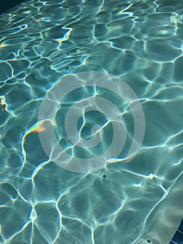 Bright blue pool water closeup
