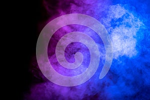 Bright blue and purple smoke isolated on black background