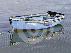 Bright Blue Skiff with Reflections