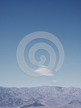 Bright blue sky above mountains