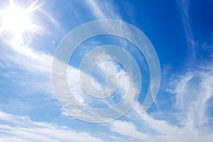 Bright blue sky clouds and sun rays