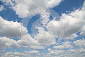 Bright blue sky with fluffy white clouds