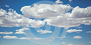 Bright blue sky with puffy clouds over Moab Utah