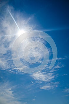 Bright blue sky with the sun causing lens flare