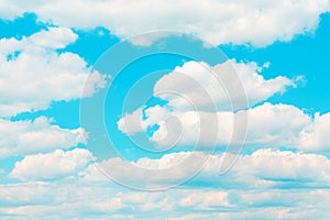 Bright blue sky with white umulus clouds