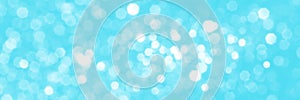 Bright blue sparkling glitter bokeh background banner