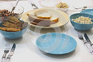 Bright blue stylish accent on the relaxed atmosphere of the table. Unpresentable appearance of photos of everyday dishes