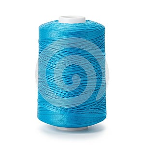Bright Blue Thread Spool on White Background sewing textile