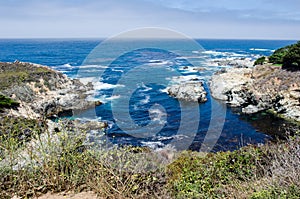 Bright blue water in the Pacific Ocean near Big Sur California along the Pacific Coast Highway