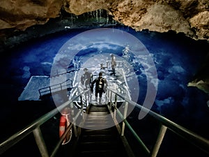 Underground blue hole in the sinkhole cavern at Devil& x27;s Den dive resort in Williston, Florida photo