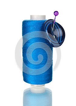 Bright bobbin thread with button isolated