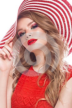 Bright cheerful girl in summer hat, colorful make-up, curls and pink manicure. Beauty face.