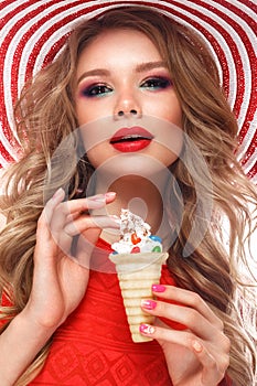 Bright cheerful girl in summer hat, colorful make-up, curls, pink manicure and ice cream in the hands. Beauty face.