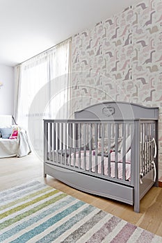 Bright child room with the stylish cot