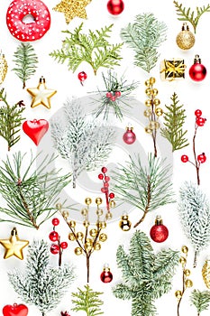 Bright Christmas background. Green fir branch, holly berries, golden stars and red baubles isolated on white background