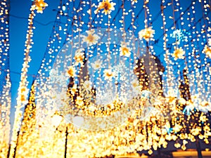 Bright Christmas Street Illumination on the facade of the buildings. The City is Decorated for the Christmastide Holiday