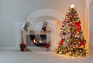 Bright Christmas tree with burning fireplace