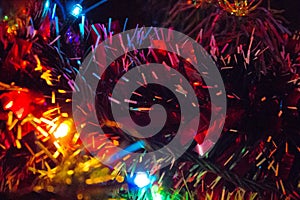 Bright Christmas tree lights and tinsel photo