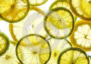 Bright citrus lime and lemon slices on white