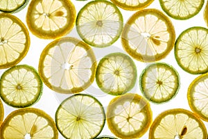 Bright citrus lime and lemon slices on white