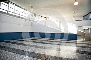 Bright clean interior. Light empty hall with windows