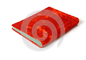 Bright open red velvet hardcover book on white background