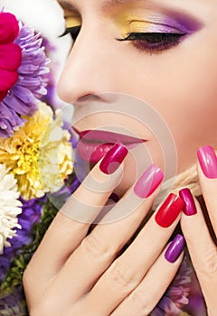 Bright color manicure and makeup.