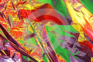 Bright color reflection on cellophane film as abstract colorful background