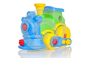 Bright colored, multi-colored steam locomotive, train, children`s collapsible toy, designer toy, isolated on a white