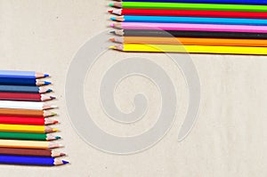 Bright colored pencils on paper background