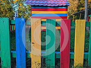 bright and colored wooden fence in the playground