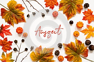 Bright Colorful Autumn Leaf Decoration, German Text Auszeit Means Downtime photo