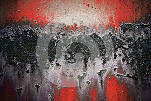 Bright colorful background from rusty metal with black, white and red shabby cracked paint