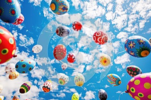 Bright Colorful balloons easter eggs in the blue sky