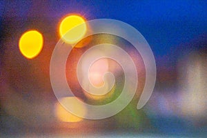 Bright colorful bokeh circles at night. Blurred city lights background