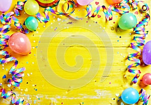 Bright colorful carnival or party frame on yellow photo