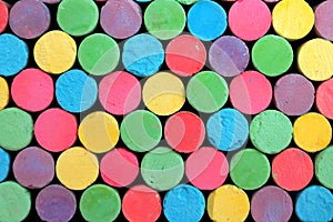 Bright colorful chalk is arranged randomly