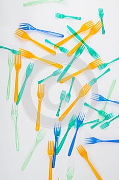 Bright and colorful dangerous plastic forks affecting nature