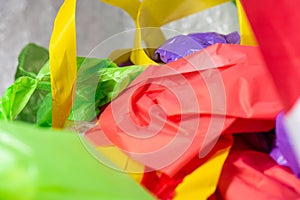 Bright colorful disposal bags and materials made from non-decomposable plastic photo