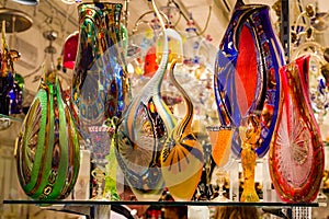 Bright, colorful Murano glassware in Venetian shop window.