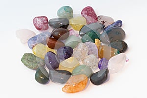 Bright colorful natural stones on a white background