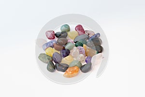 Bright colorful natural stones on a white background