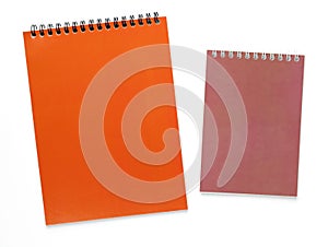 Bright colorful notepads isolated on white background